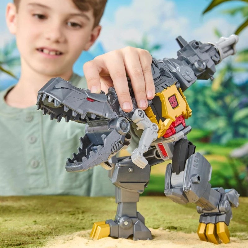 Child playing with Transformers Cyberworld Chomp & Battle Grimlock dinosaur toy in action.